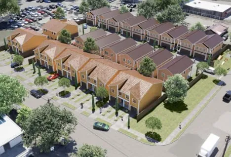 Concept rendering from above of two-story homes along a drive lined with trees