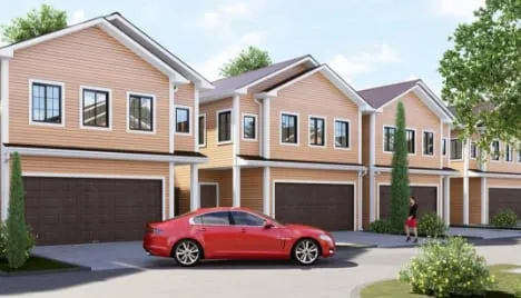 Concept rendering at street level of two-story homes with a car parked in front
